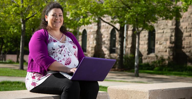 Student on computer is Ruth Delgado.